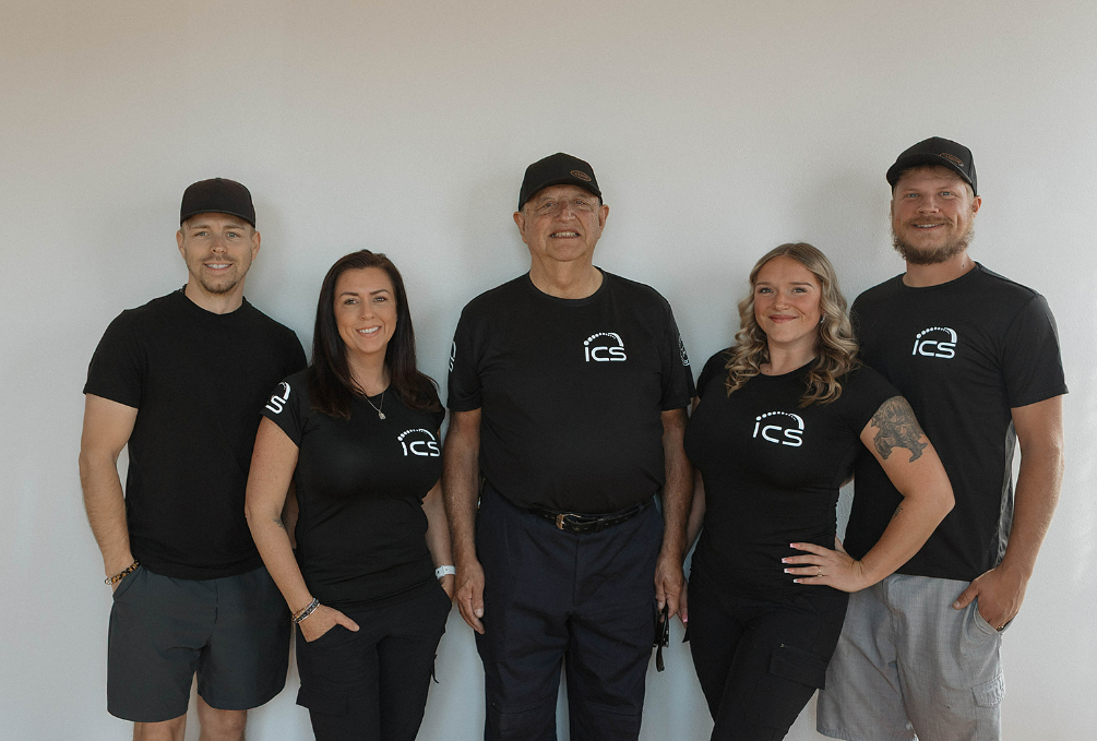 The ICS team — five professionals in branded ICS shirts